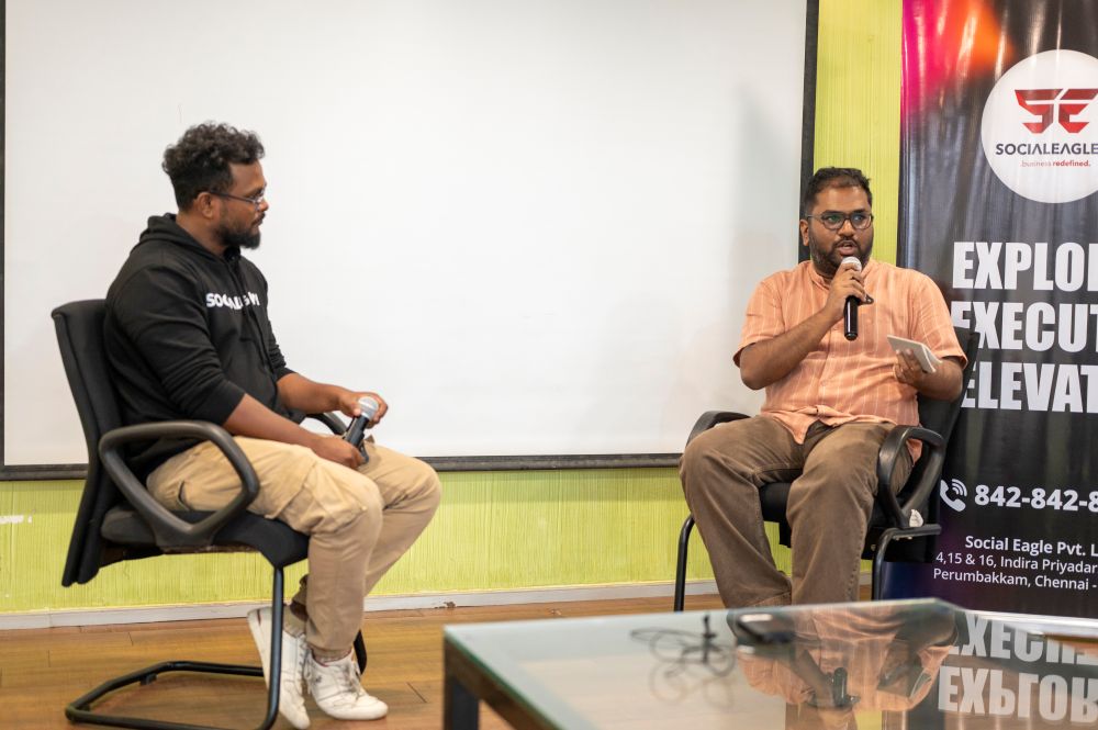 Students collaborating on laptops in classroom