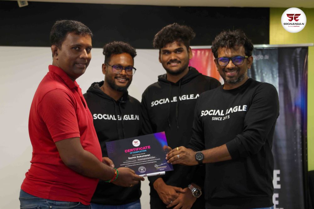 Group of men in meeting discussion with man in pink shirt prominently featured