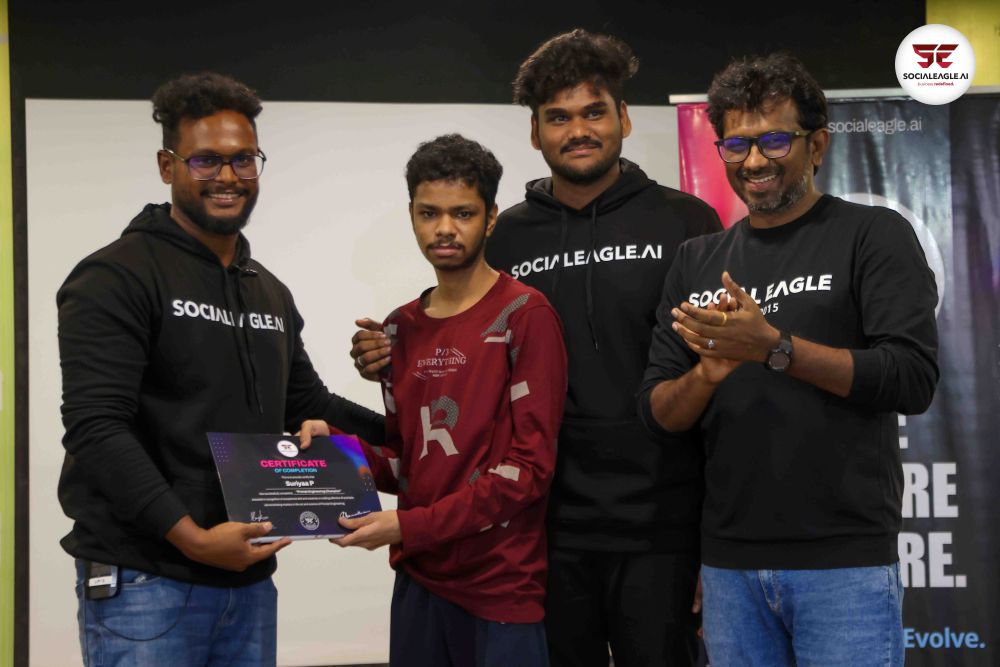 Crowded classroom with many students working on laptops