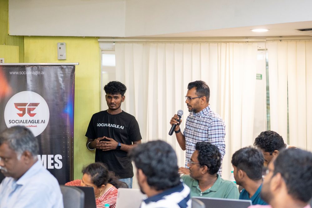 Close-up of students collaborating around laptops