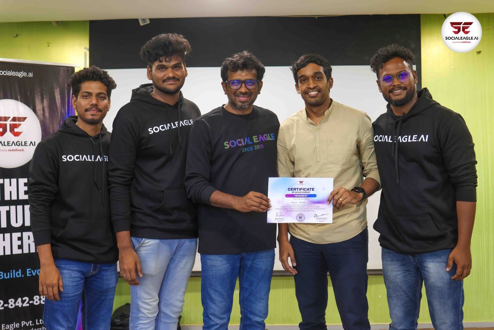 Group photo including elderly woman with certificates