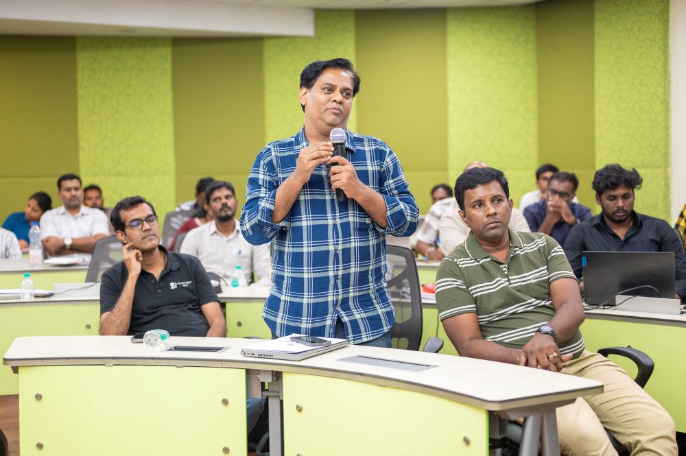 Woman presenter speaking at podium